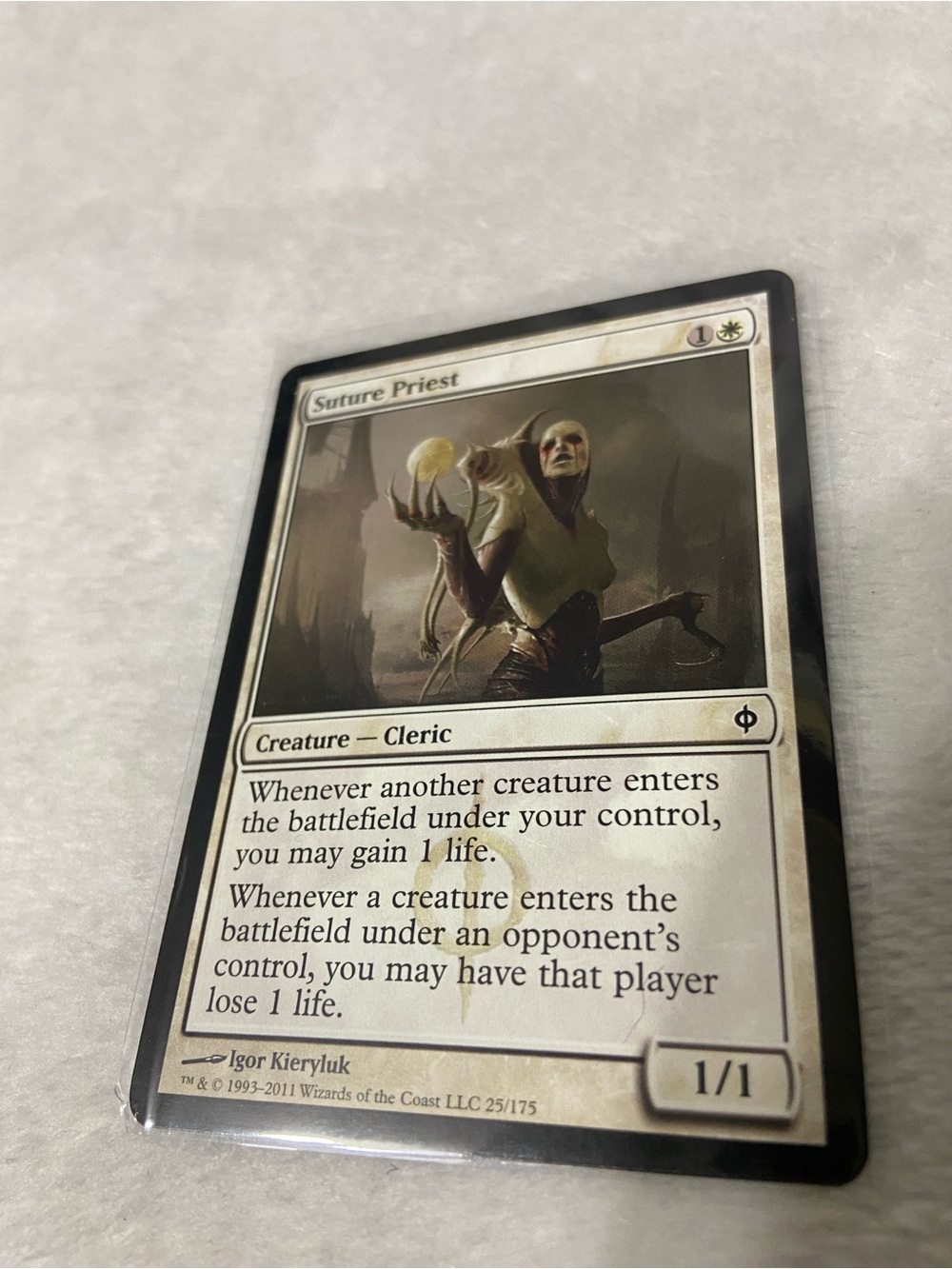 Suture Priest #25/175 New Phyrexia.